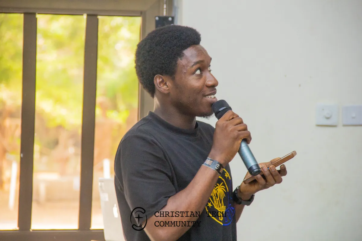 A young man asks a question into a microphone at CTC 1.0.